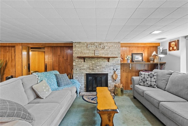 529 Backus Rd, Webster, NY 14580 - living area with wooden walls, carpet floors, and a fireplace