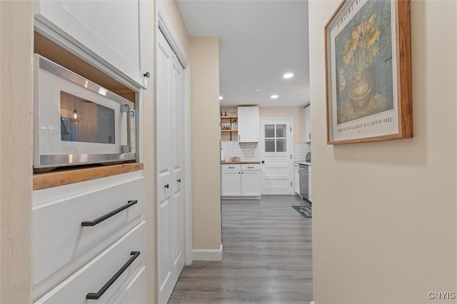 101 Doll Pkwy, Syracuse, NY 13214 - hall featuring dark wood-style floors, recessed lighting, and baseboards