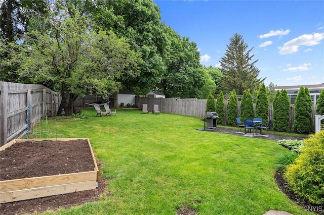 101 Doll Pkwy, Syracuse, NY 13214 - view of yard with a vegetable garden and a patio