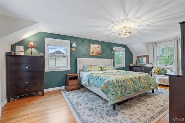 101 Doll Pkwy, Syracuse, NY 13214 - bedroom with light wood-style flooring, lofted ceiling, and baseboards