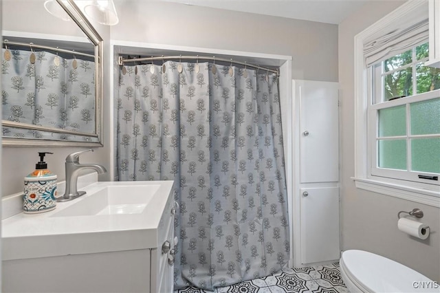 101 Doll Pkwy, Syracuse, NY 13214 - bathroom with vanity, toilet, and curtained shower