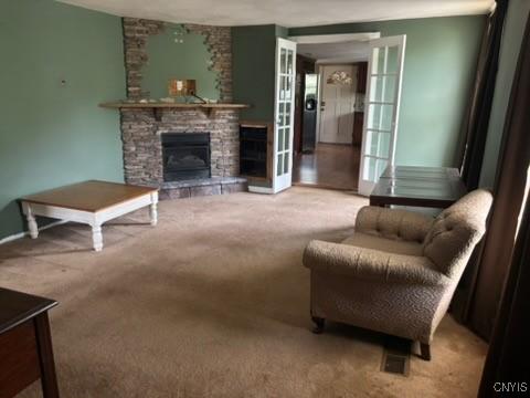 2334 State Route 49th Hwy, West Monroe, NY 13167 - carpeted living room featuring a stone fireplace