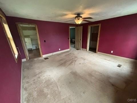 2334 State Route 49th Hwy, West Monroe, NY 13167 - unfurnished bedroom featuring baseboards, carpet, and ceiling fan