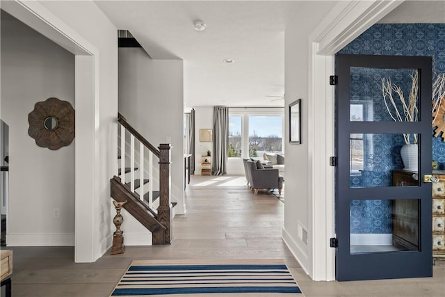 108 Chase Meadow Trl, Mendon, NY 14472 - foyer entrance with stairs, wood finished floors, and baseboards