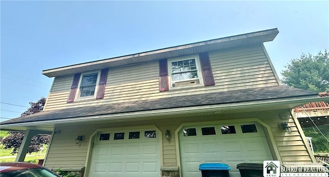 9983 Deer Creek Rd, Genesee, NY 14770 - view of side of property featuring an attached garage and roof with shingles