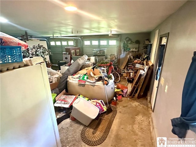 9983 Deer Creek Rd, Genesee, NY 14770 - miscellaneous room featuring concrete flooring, a garage, and healthy amount of natural light