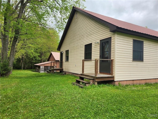 381 French Rd, Morehouse, NY 13324 - rear view of property with metal roof and a yard
