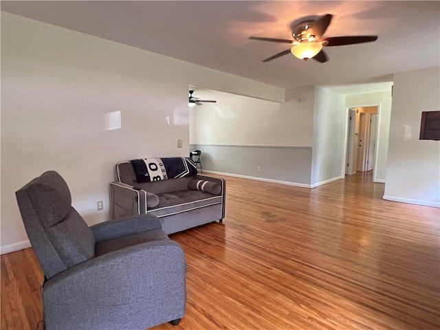 793 Helendale Rd, Irondequoit, NY 14609 - living room featuring a ceiling fan, wood finished floors, and baseboards