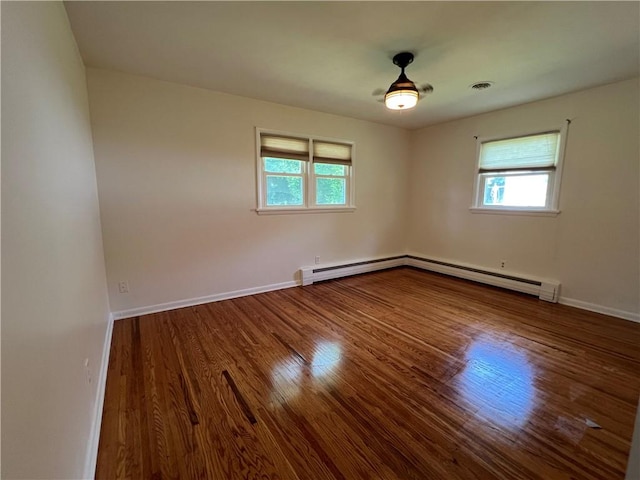 793 Helendale Rd, Irondequoit, NY 14609 - spare room with plenty of natural light, wood finished floors, and baseboards