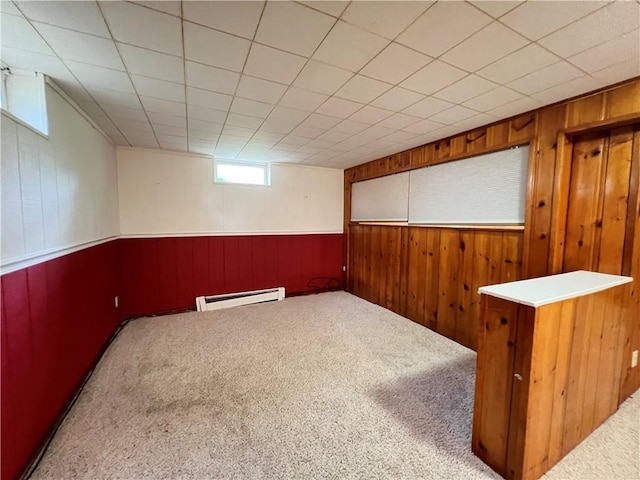 793 Helendale Rd, Irondequoit, NY 14609 - basement with baseboard heating, wood walls, carpet flooring, and wainscoting