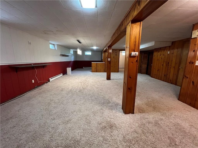 793 Helendale Rd, Irondequoit, NY 14609 - below grade area featuring a baseboard heating unit, carpet flooring, and wood walls