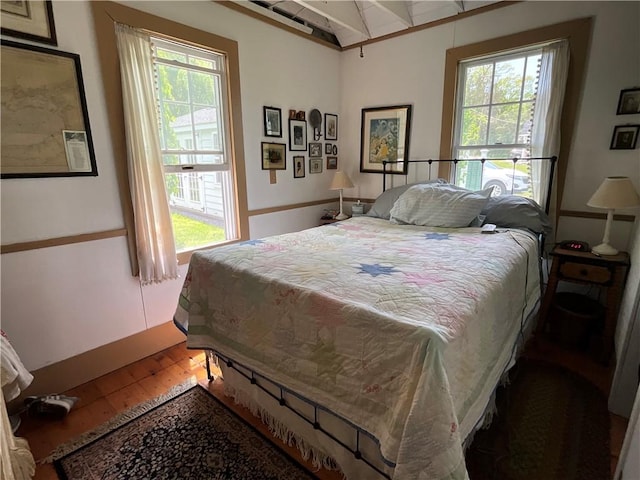 14415 Oak Orchard On The Lk, Carlton, NY 14571 - bedroom featuring multiple windows, wood finished floors, and beam ceiling