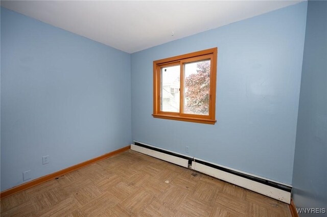 965 Walden Ave, Buffalo, NY 14211 - spare room featuring a baseboard radiator and baseboards
