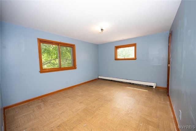 965 Walden Ave, Buffalo, NY 14211 - spare room with a baseboard heating unit and baseboards