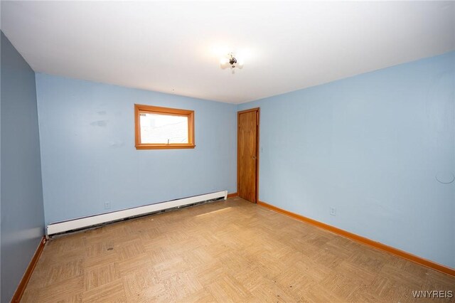 965 Walden Ave, Buffalo, NY 14211 - empty room with baseboard heating and baseboards