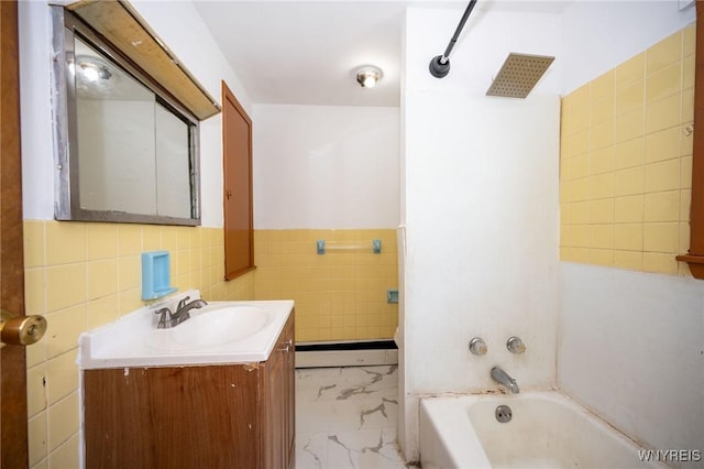 965 Walden Ave, Buffalo, NY 14211 - bathroom with tile walls, baseboard heating, vanity, marble finish floors, and shower / tub combination