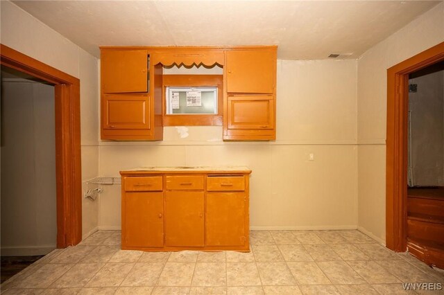 965 Walden Ave, Buffalo, NY 14211 - kitchen with light countertops, light tile patterned floors, and baseboards