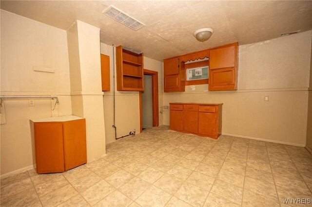 965 Walden Ave, Buffalo, NY 14211 - kitchen with brown cabinetry and open shelves