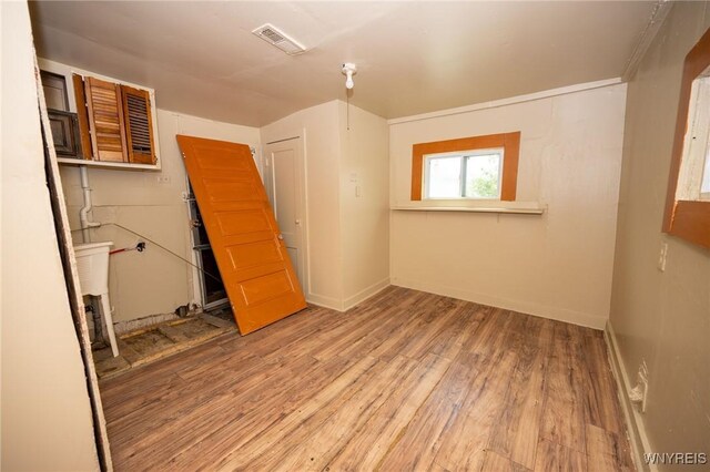965 Walden Ave, Buffalo, NY 14211 - empty room with wood finished floors and baseboards
