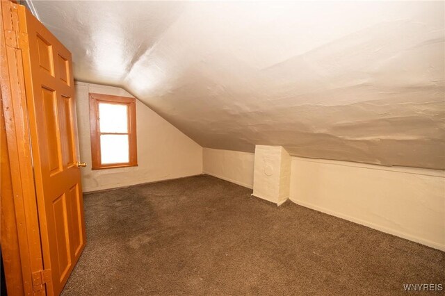 965 Walden Ave, Buffalo, NY 14211 - additional living space featuring vaulted ceiling and dark colored carpet