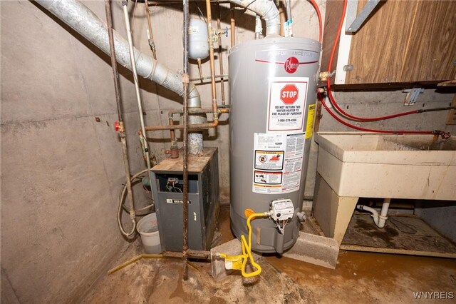 965 Walden Ave, Buffalo, NY 14211 - utility room with gas water heater and a heating unit