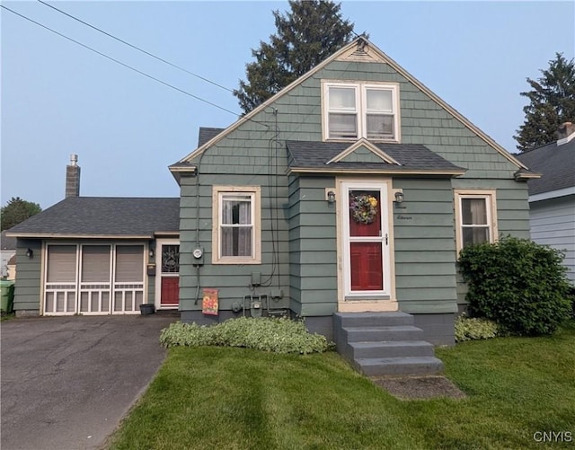 311 Raphael Ave, Salina, NY 13211 - bungalow featuring a front lawn, roof with shingles, and a chimney