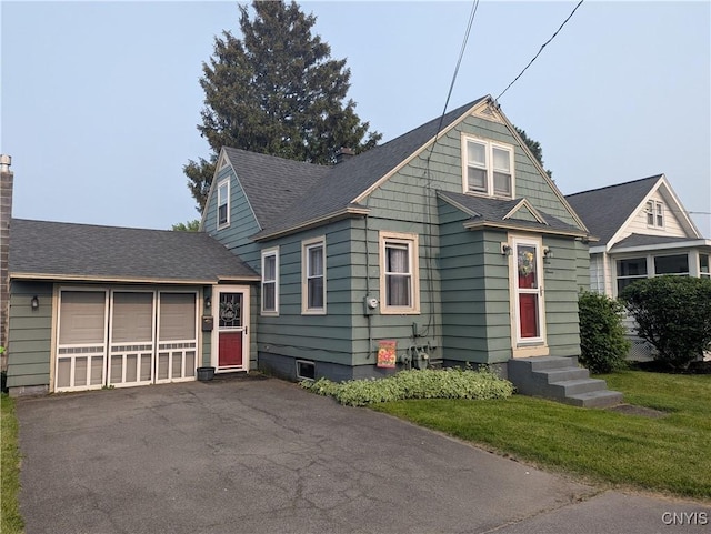 311 Raphael Ave, Salina, NY 13211 - bungalow-style house featuring driveway, a chimney, a garage, and roof with shingles