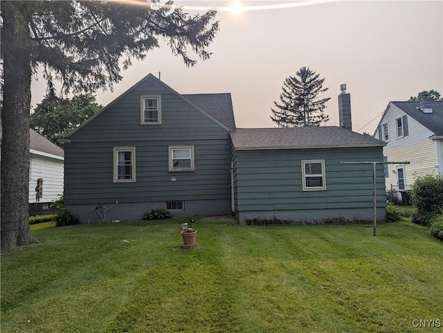 311 Raphael Ave, Salina, NY 13211 - rear view of property featuring a lawn, a chimney, and roof with shingles
