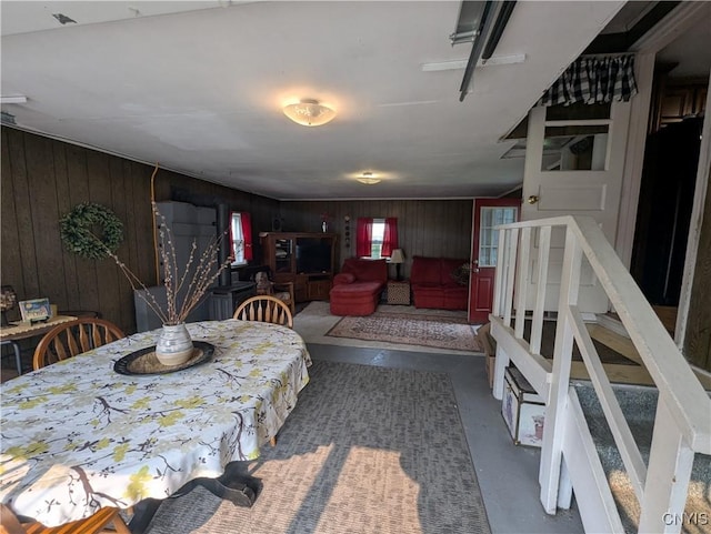 311 Raphael Ave, Salina, NY 13211 - dining room featuring finished concrete floors and wooden walls