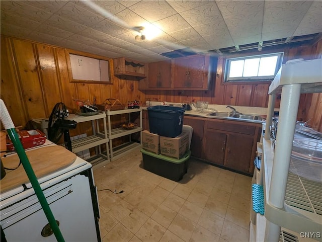 311 Raphael Ave, Salina, NY 13211 - basement with a sink, wooden walls, and light floors