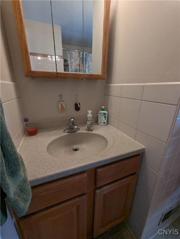 311 Raphael Ave, Salina, NY 13211 - bathroom with vanity and tile walls