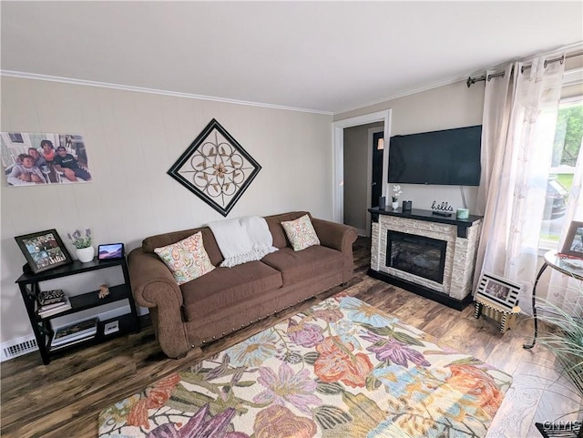311 Raphael Ave, Salina, NY 13211 - living area featuring wood finished floors, crown molding, and a stone fireplace
