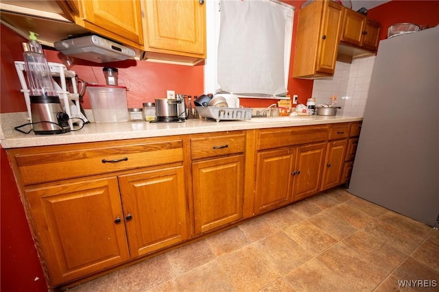 639 36th St, Niagara Falls, NY 14301 - kitchen with light countertops, a sink, and brown cabinetry
