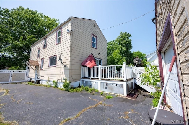 639 36th St, Niagara Falls, NY 14301 - view of side of property with a wooden deck and a gate