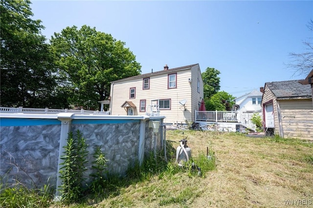 639 36th St, Niagara Falls, NY 14301 - rear view of house with a chimney