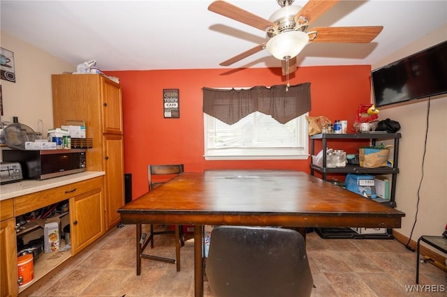 639 36th St, Niagara Falls, NY 14301 - dining area featuring a ceiling fan and stone finish floors