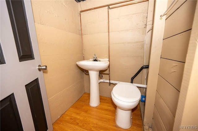 639 36th St, Niagara Falls, NY 14301 - half bathroom with toilet and wood finished floors
