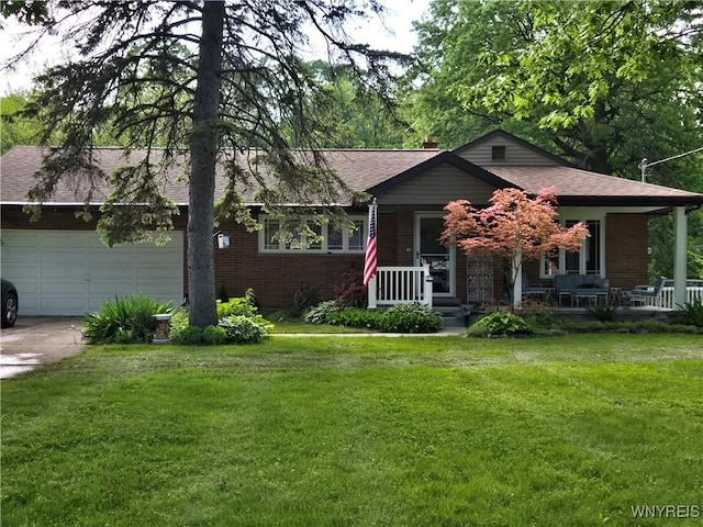 5092 Dana Dr, Lewiston, NY 14092 - view of front of house with brick siding, concrete driveway, roof with shingles, and a porch