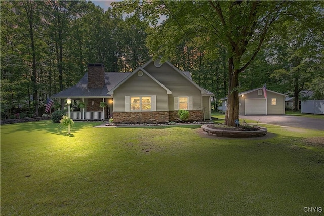45 Center St, Constantia, NY 13042 - view of front of property with a porch, an outbuilding, a chimney, driveway, and a detached garage