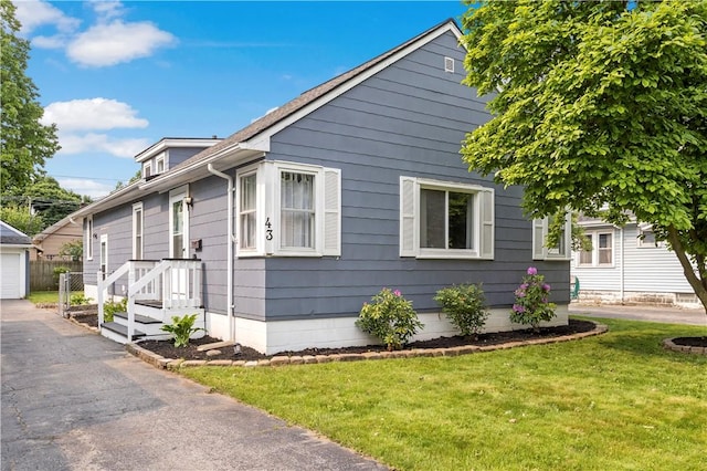 43 Hager Rd, Greece, NY 14616 - view of property exterior featuring a yard and an outdoor structure