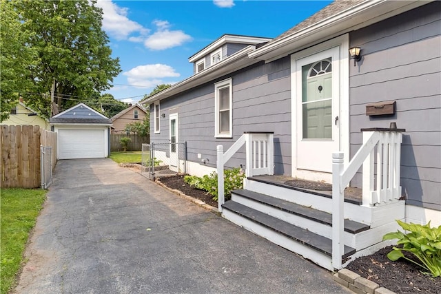 43 Hager Rd, Greece, NY 14616 - view of property exterior featuring a garage, an outdoor structure, and driveway