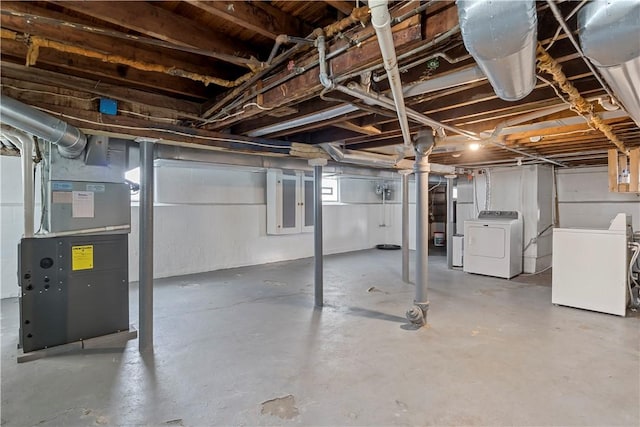 43 Hager Rd, Greece, NY 14616 - unfinished below grade area featuring washing machine and dryer and heating unit