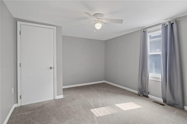 43 Hager Rd, Greece, NY 14616 - spare room featuring ceiling fan, carpet, and baseboards