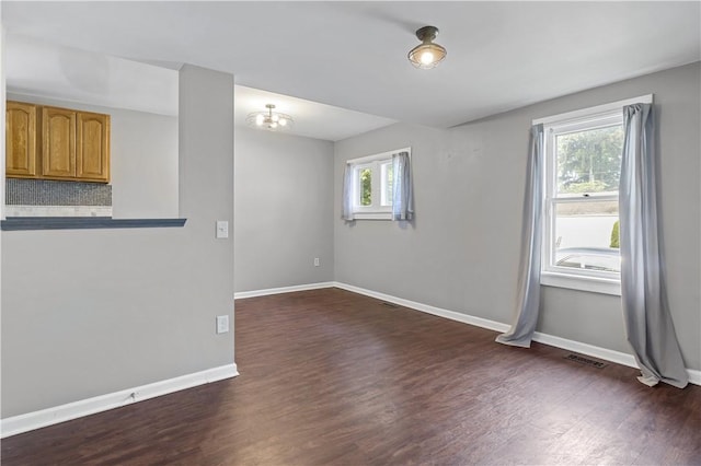 43 Hager Rd, Greece, NY 14616 - spare room featuring dark wood-style floors and baseboards