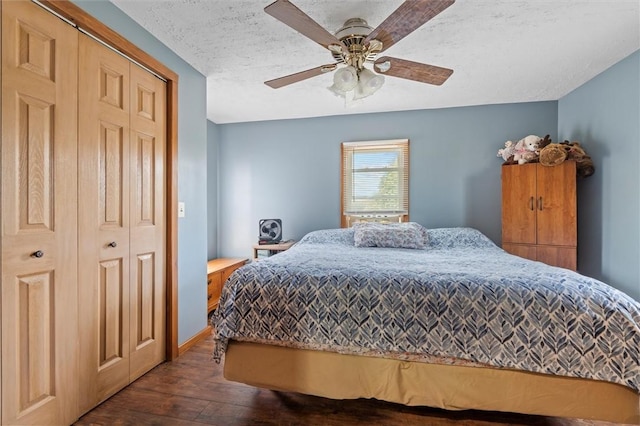 13385 Seneca St, Savannah, NY 13146 - bedroom with dark wood-type flooring, a ceiling fan, and a textured ceiling