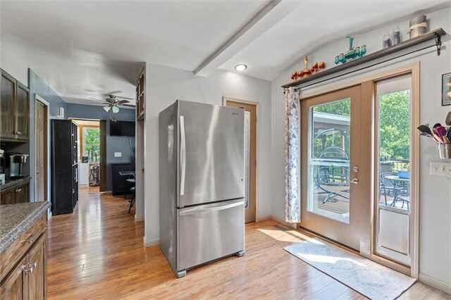 13385 Seneca St, Savannah, NY 13146 - kitchen featuring freestanding refrigerator, light wood finished floors, a ceiling fan, baseboards, and lofted ceiling
