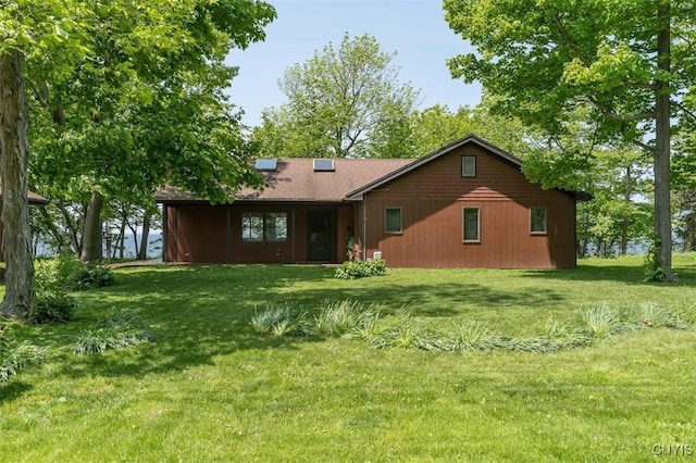 4859 Becker Ln, Lyme, NY 13693 - back of house featuring a lawn