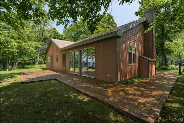 4859 Becker Ln, Lyme, NY 13693 - view of property exterior with a deck, a yard, and a chimney