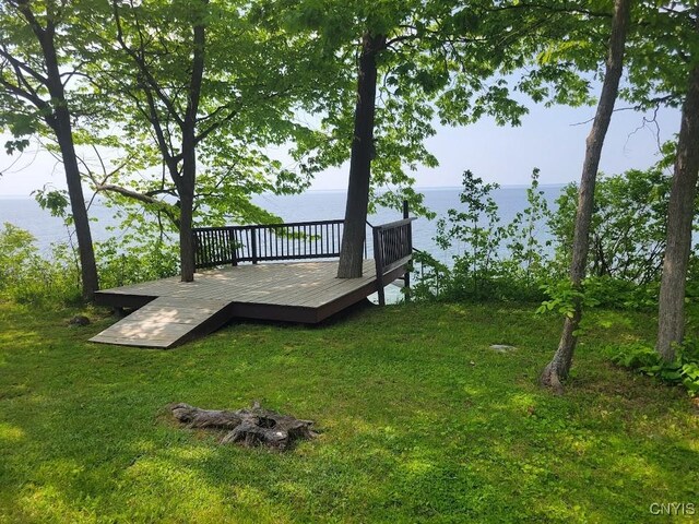 4859 Becker Ln, Lyme, NY 13693 - view of green lawn featuring a deck with water view