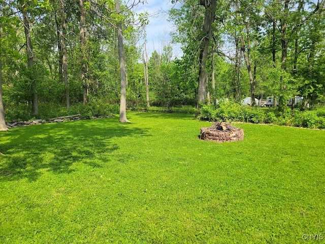 4859 Becker Ln, Lyme, NY 13693 - view of green lawn featuring an outdoor fire pit